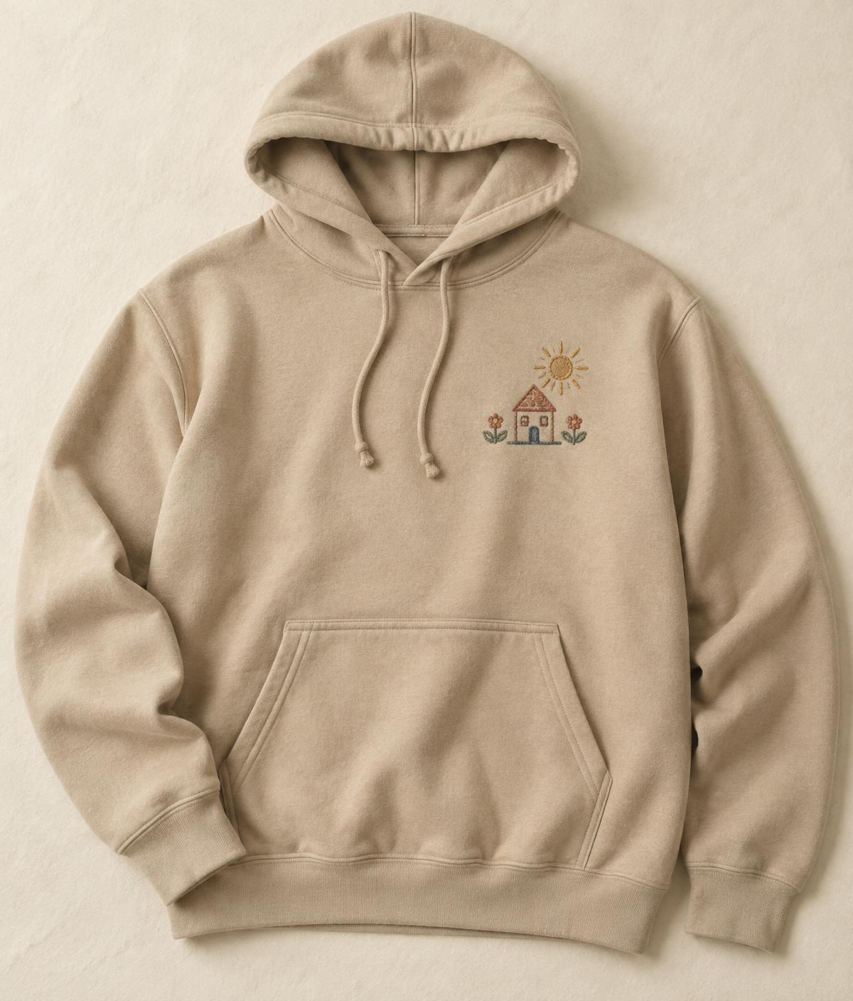 Sand hoodie with a small embroidered child's drawing of a house, sun and flowers